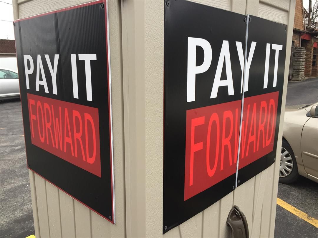 Struthers volunteers offering Pay It Forward box