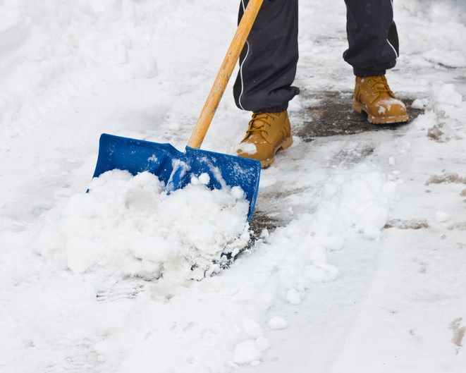 Alliance City School District volunteers help clear sidewalks, bus stops