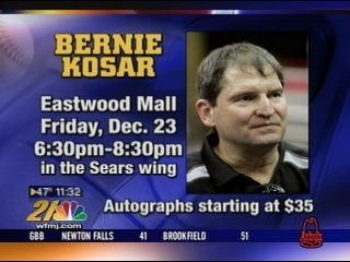 Former Cleveland Browns quarterback Bernie Kosar, left, talks with