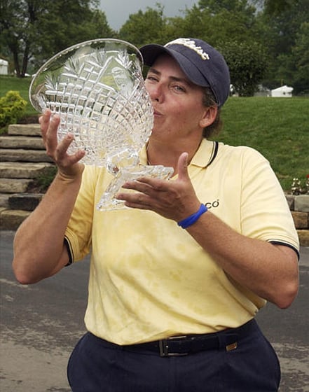 Moira Dunn kisses the trophy after winning the Giant Eagle LPGA Classic Sunday, July 18, 2004, at the Squaw Creek Country Club in Vienna, Ohio. Dunn finished the tournament at 12-under par. (AP Photo/Tony Dejak)