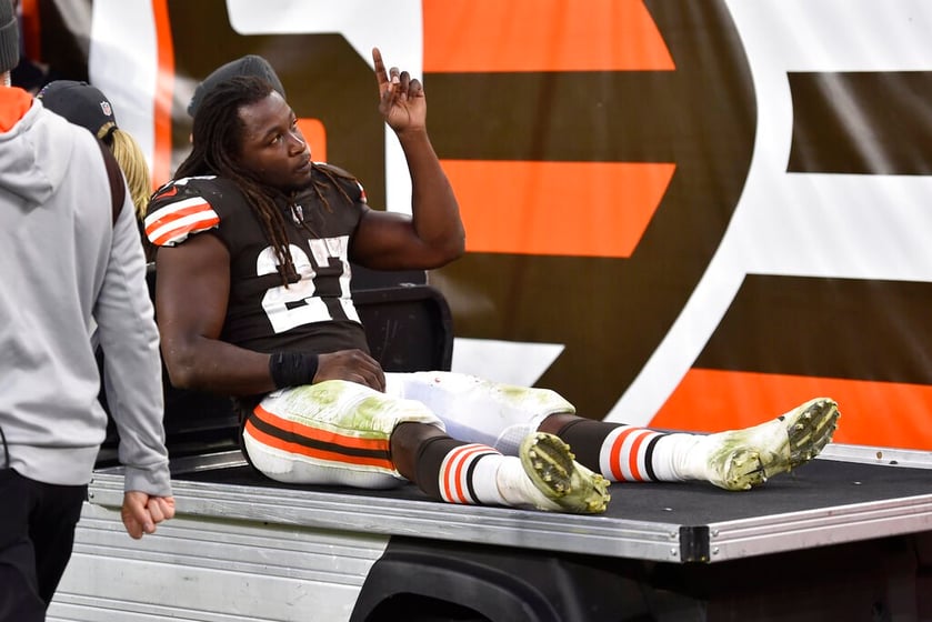 Cleveland Browns running back Kareem Hunt reacts to fans while he is carted to the locker room during an NFL football game against the Arizona Cardinals, Sunday, Oct. 17, 2021, in Cleveland. The Cardinals won 37-14.