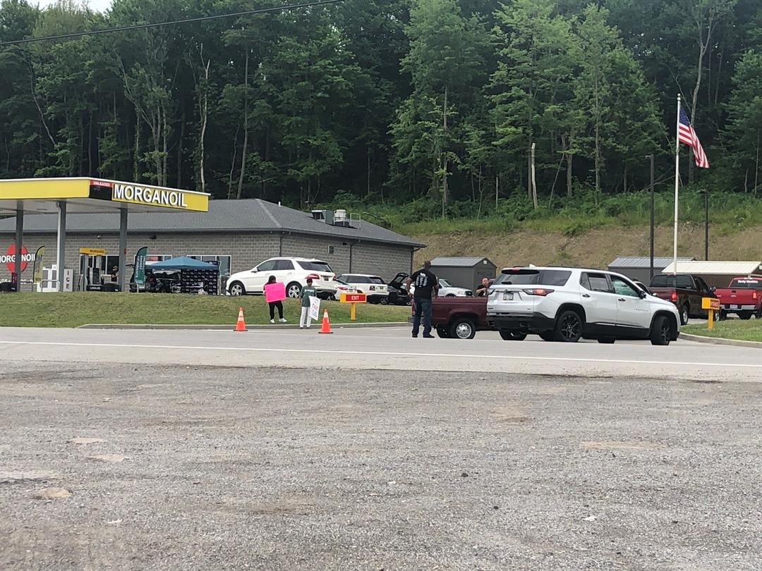 Vehicles line up for cheap gas event at Oil