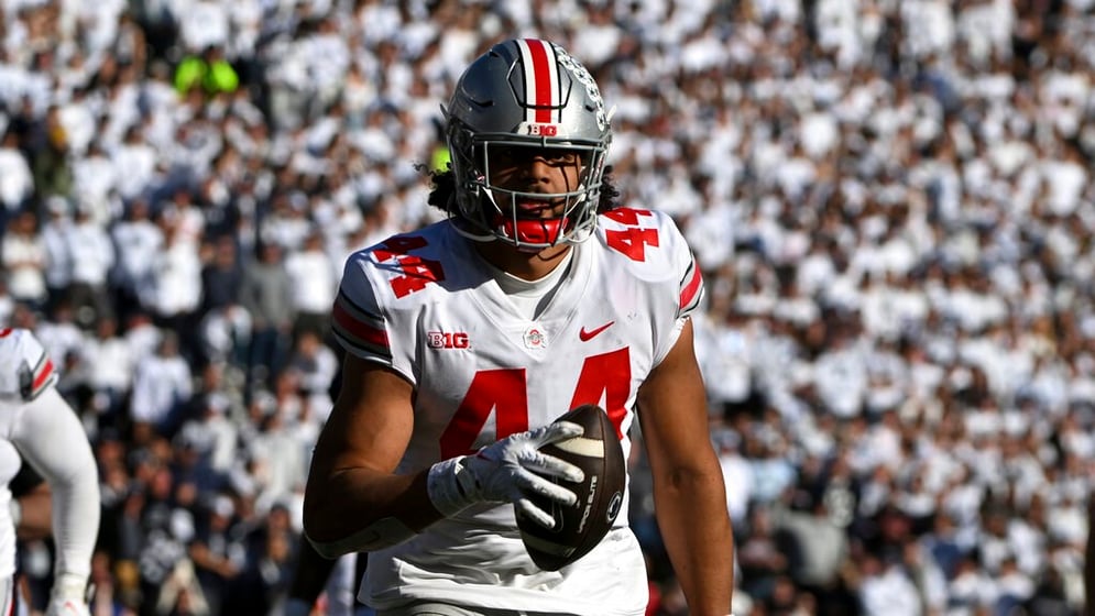 Ohio State defensive end J.T. Tuimoloau (44) returns an interception for a touchdown against Penn State during an NCAA college football game, Saturday, Oct. 29, 2022, in State College, Pa.