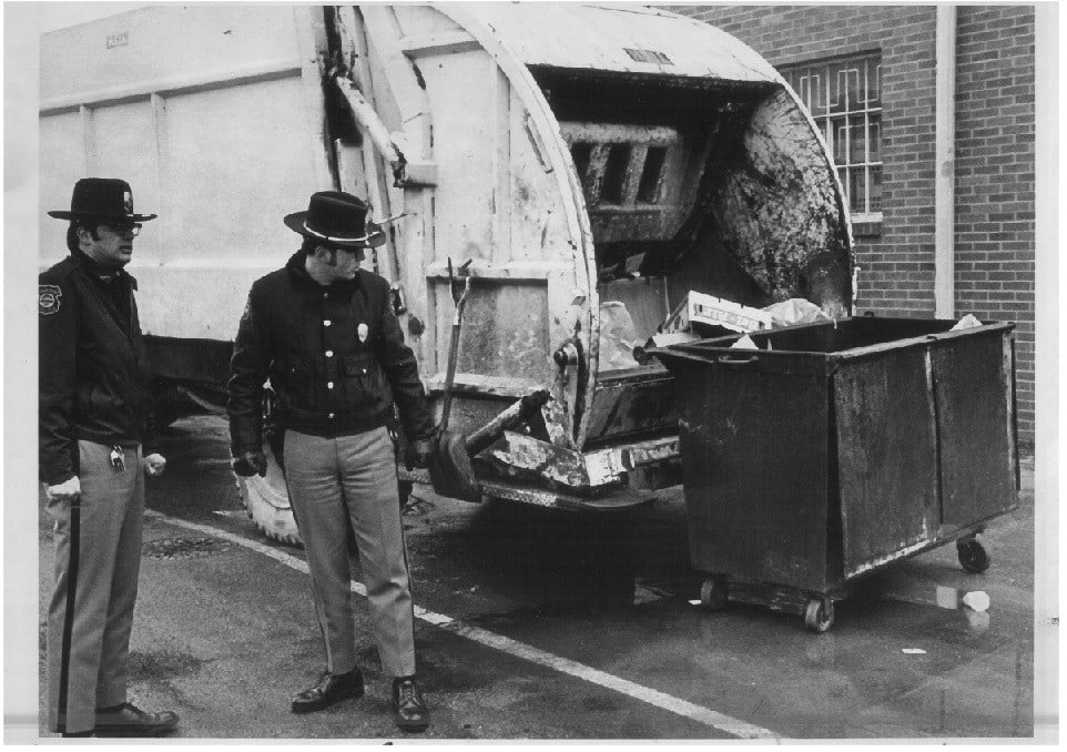 Boardman police officers Glenn Bowers and George Statler investigate the discovery of Bellino's body