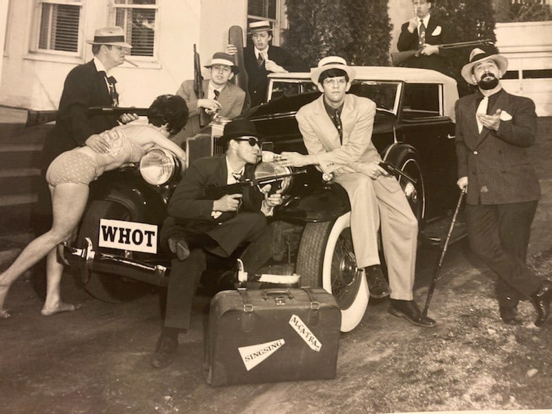 Jerry Starr with The Good Guys, back center with his arm on the roof of the car.