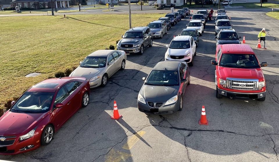 Dozens of cars line up one Saturday each month for food distribution at First Federated Church on Mahoning Avenue in North Jackson.