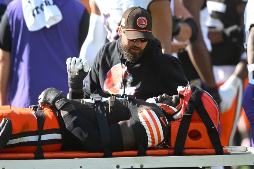 Cleveland Browns linebacker Jeremiah Owusu-Koramoah (6) is taken off the field during the second half of an NFL football game against the Baltimore Ravens in Cleveland, Sunday, Oct. 27, 2024.