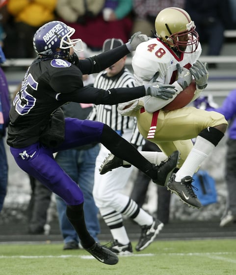 Bridgewater's Steward White, right, grabs an interception in front of Mount Union's Nick Sirianni in the first quarter during the semifinals of the NCAA Division III playoffs at Mount Union Stadium Saturday, Dec. 13, 2003, in Alliance, Ohio. Mount Union w