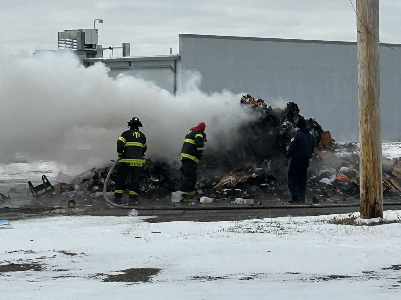 VIDEO: Crews battle trash fire behind Mahoning Plaza shopping center