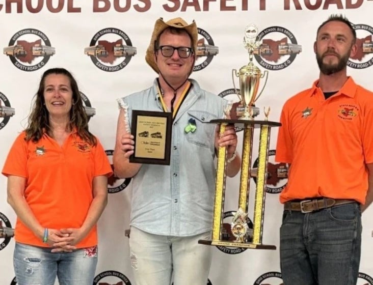 Struthers City Schools bus driver, Ryan Dunn (center), accepts his first place award for the Ohio State School Bus Road-E-O competition.