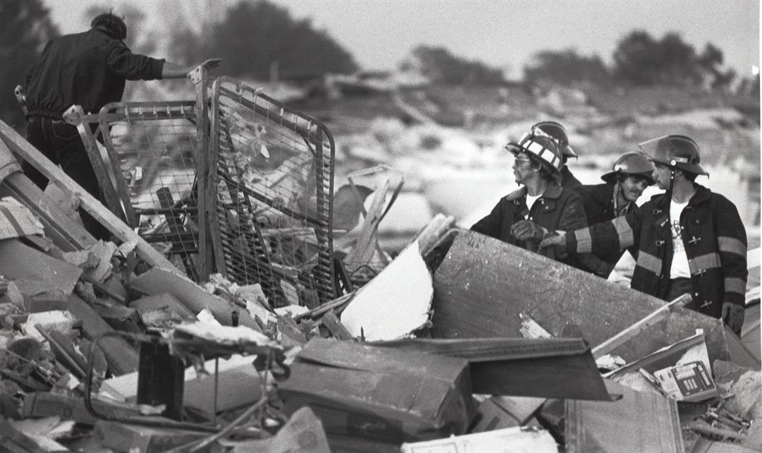 Fire crews in Niles search the rubble at the roller rink