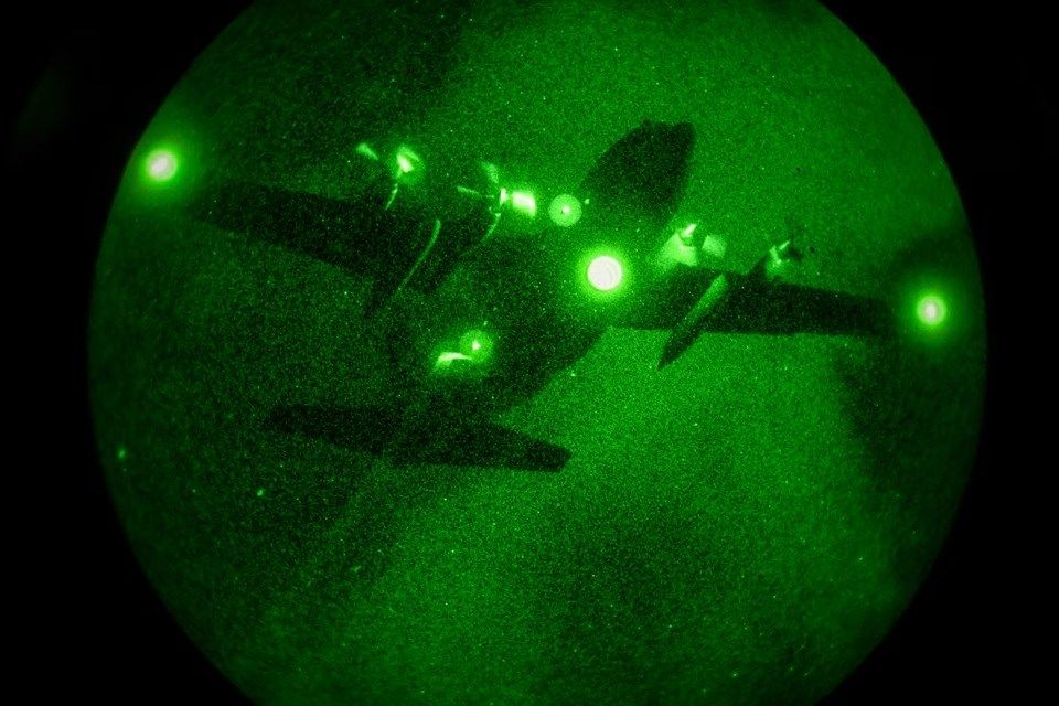 A 910th Airlift Wing aerial spray-modified C-130H Hercules aircraft disperses mosquito control product, Sept. 9, 2025, over the marsh areas of the Naval Weapons Station, Joint Base Charleston, South Carolina.