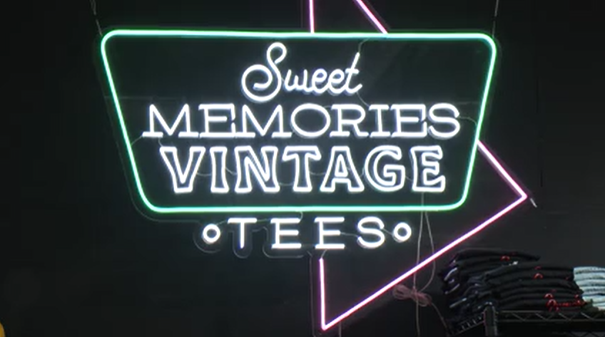Sweet Memories Vintage Tees presents check donation, celebrating three-year anniversary