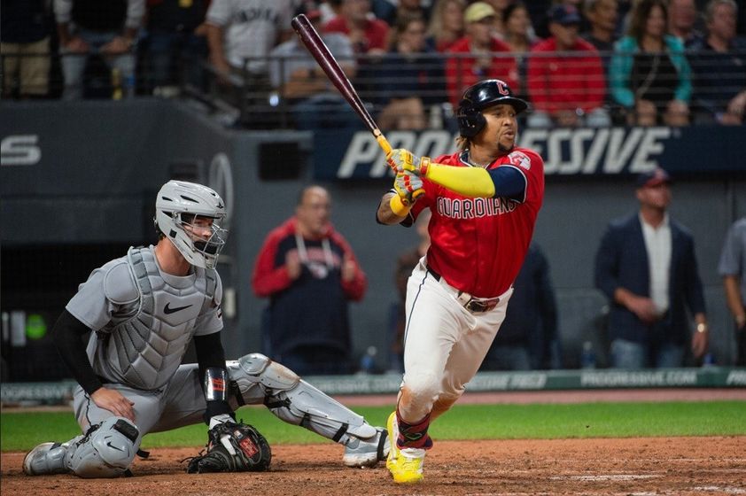 Cleveland Guardians' Jose Ramirez, right, watches his two-run RBI double off Detroit Tigers relief pitcher Will Vest as catcher Dillon Dingler, left, looks on during the seventh inning of a baseball game (AP Photo/Phil Long)