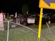 Car catches fire after crashing into cemetery in Austintown