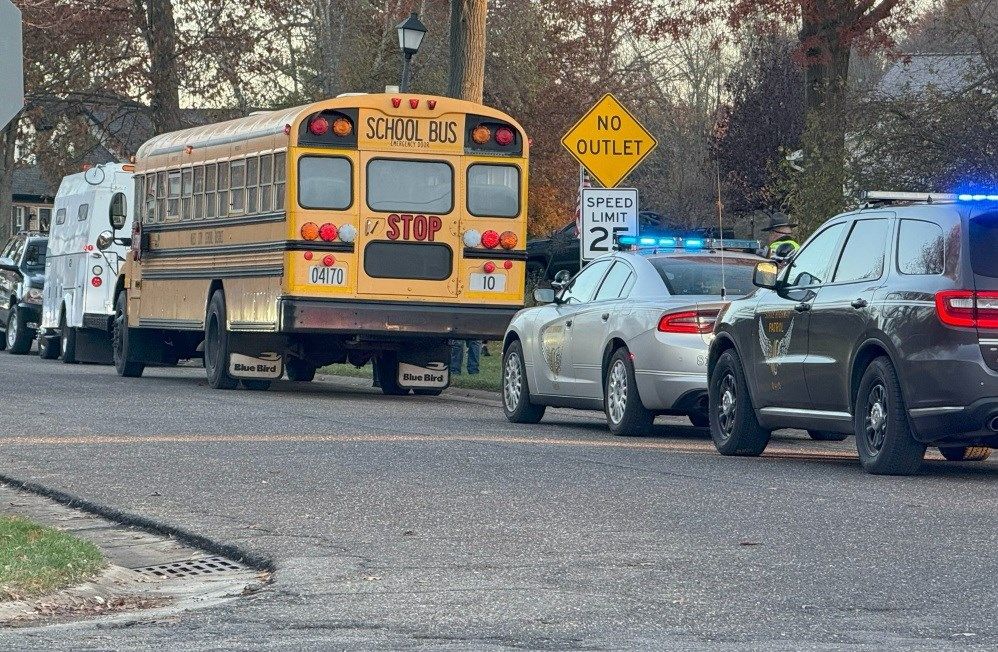 OSP: Niles School bus transporting students clips car