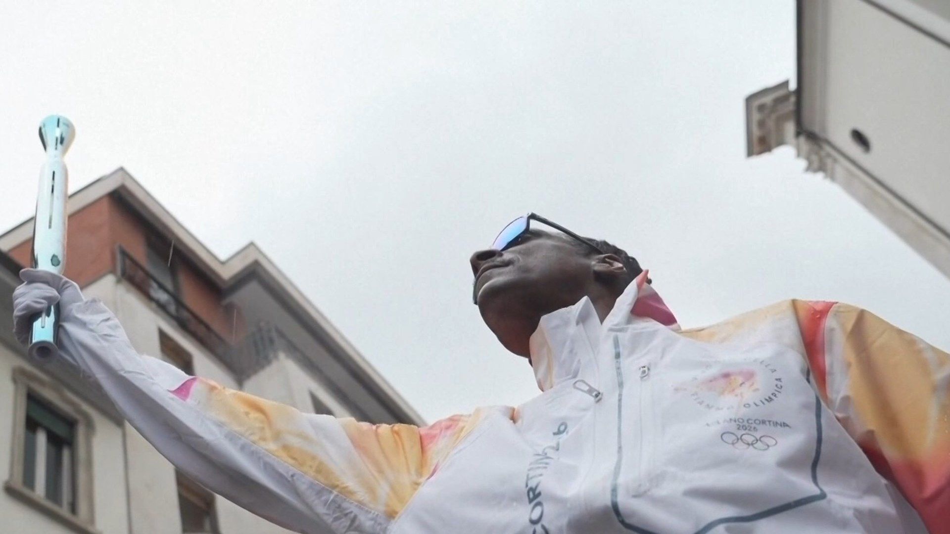 Snoop Dogg carries Olympic Torch through streets of Milan