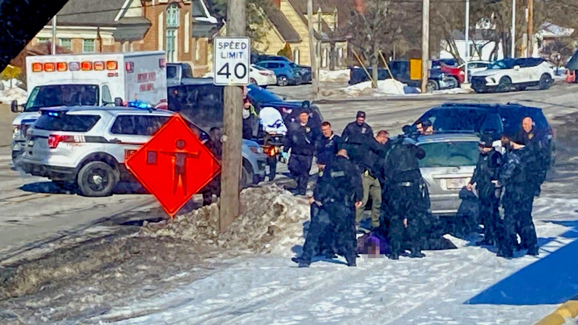 This photo was provided to 21 News of a person on the ground near the stopped vehicle