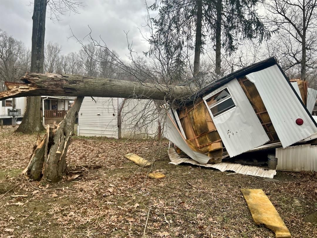 Wind causes home damage, closures, and leaves thousands without power