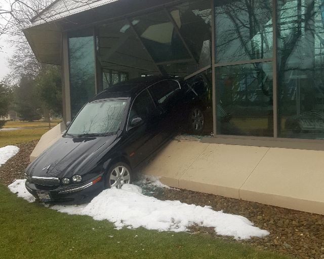 Car backs into Warren church